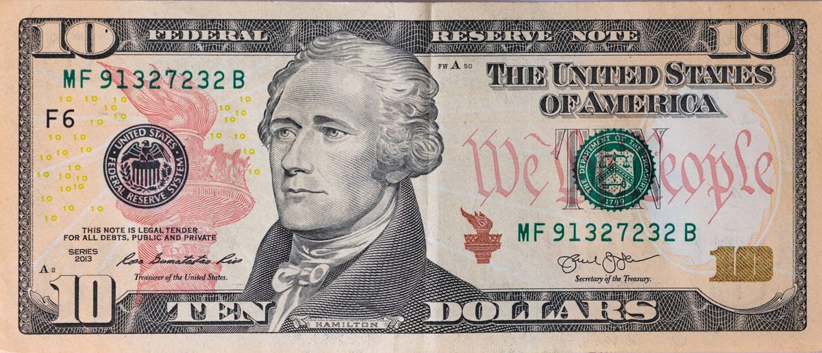 A photo of a 10 dollar note showing Hamilton's face.