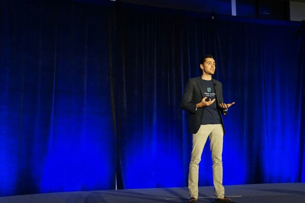 A person presenting on stage without slides